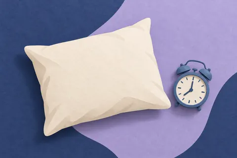 Paper collage of a pillow and blue alarm clock